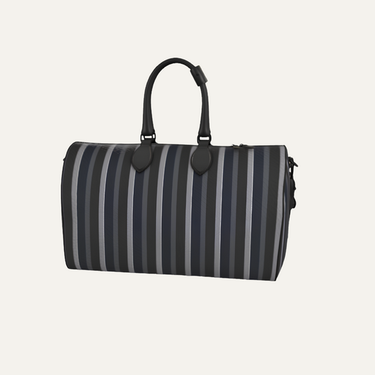 Teddie London bespoke Gunmetal heavy pebble grain textured leather travel duffle bag featuring the asymmetrical Barbican Stripe and polished nickel hardware.