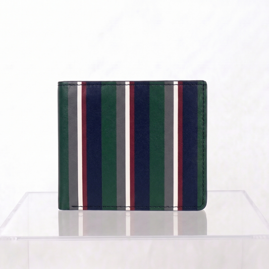 Close up of soft full-grain bovine-calf Nappa leather on the Teddie London Club Stripe wallet with a striped pattern of forest green, navy blue, white, and burgundy, displayed on a clear acrylic stand against a white background.